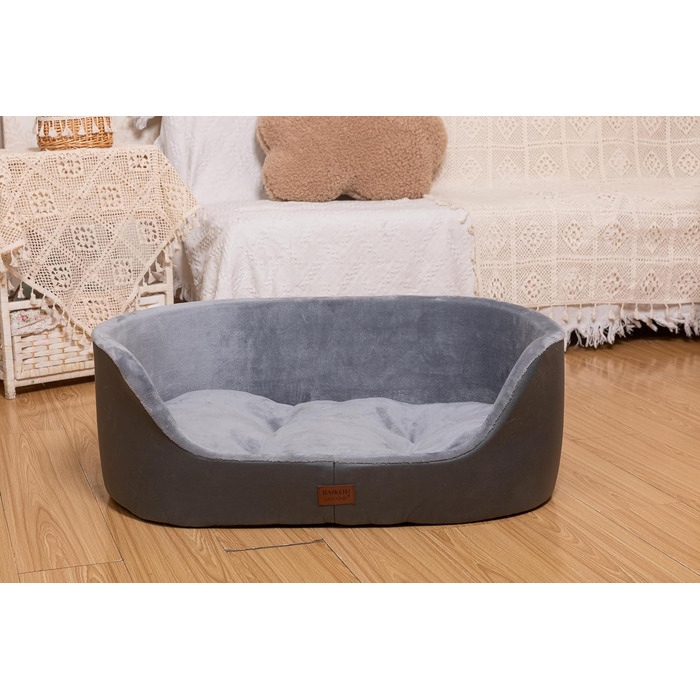 Кругле собаче ліжко RAIKOU середнього розміру, м'яке та зручне, з антиковзким покриттям. Підходить для собак та котів середніх порід (75 x 54 x 27 см), чорного кольору