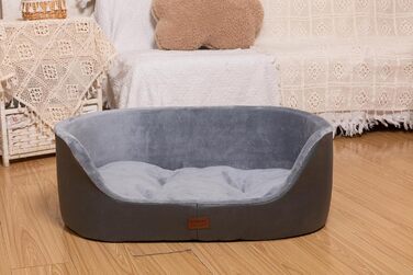 Кругле собаче ліжко RAIKOU середнього розміру, м'яке та зручне, з антиковзким покриттям. Підходить для собак та котів середніх порід (75 x 54 x 27 см), чорного кольору